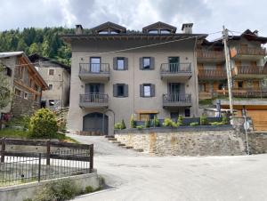 a large building with balconies on the side of it at Angel's Home 1 in Ponte di Legno