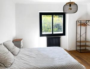 Postel nebo postele na pokoji v ubytování L'Auberge du Ranc