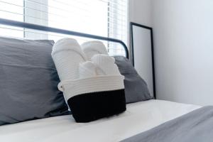 a pair of socks and towels on a bed at Private Room with Lock in Cambridge