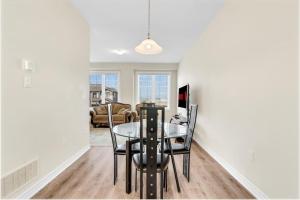 a dining room with a glass table and chairs at Private Room with Lock in Cambridge