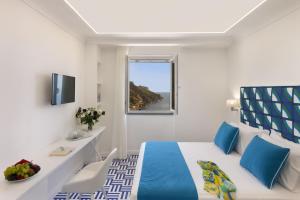 TV a/nebo společenská místnost v ubytování Gala Residence Villa Giovanna