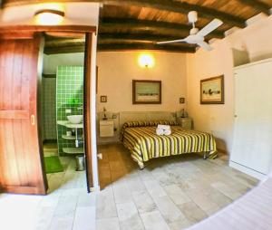 a bedroom with a bed and a sink and a ceiling at Guest House Villa Verde - Short Term Room Rentals in Torre delle Stelle