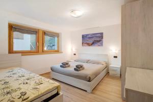 En eller flere senge i et værelse på Palipert Flowers House