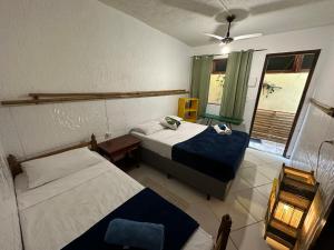 Postel nebo postele na pokoji v ubytování Maresia Hostel Paraty BR