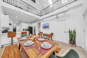 a kitchen and dining room with a wooden table and chairs at Skyline Loft in Buffalo