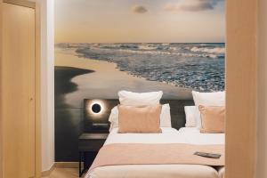 Postel nebo postele na pokoji v ubytování Palau Suites & Apartments