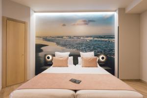 Postel nebo postele na pokoji v ubytování Palau Suites & Apartments