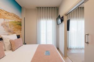 TV a/nebo společenská místnost v ubytování Palau Suites & Apartments