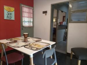 a table and chairs in a room at Casa Norte in La Rioja