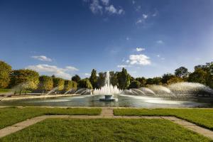 a fountain in the middle of a park at Battersea Park apartments in London