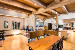 a large kitchen with a wooden table and chairs at Best Western Antlers in Glenwood Springs