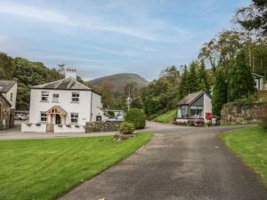 a house on a road in a village at Apartment 4 in Keswick