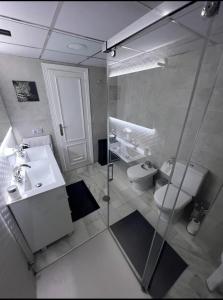 a bathroom with a shower and a sink and a toilet at Puerto Banus in Marbella