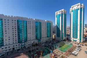 an aerial view of a city with tall buildings at 19 2х комн с 2 мя кроватями и раскладной диван,2 санузла 1- 6 человек,возле Байтерека in Astana