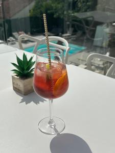 a drink in a glass sitting on a table at Hotel La Voile in Bormes-les-Mimosas