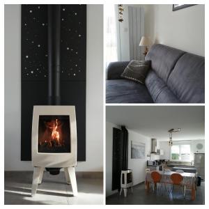Una sala de estar con un sofá y una chimenea. en Au Bon ENdrOIT, en Barneville-Carteret