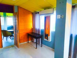 a small room with a table and a window at Yala Bay Holiday Resort in Tissamaharama