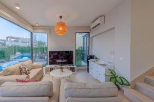 Area soggiorno di Elegant 4BR in Tawila, Gouna. Private Pool, Lagoon