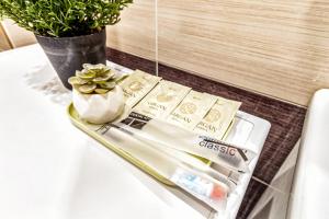 a bathroom table with a toothbrush and a tube of toothpaste at 1 комнатная квартира в Элитном доме in Pavlodar +6 photos