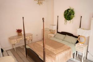 a bedroom with a bed and a table and a mirror at Sara’s Apartment in Seaham
