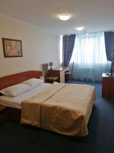 Postel nebo postele na pokoji v ubytování Cherkasy Palace