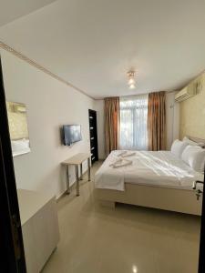 Ένα ή περισσότερα κρεβάτια σε δωμάτιο στο Hotel Marina 2