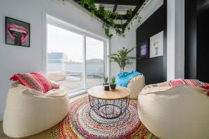 a living room with two chairs and a table at Heaven's Garden / / Luxury penthouse downtown in Quebec City