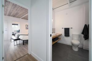 a bathroom with a toilet and a sink at Heaven's Garden / / Luxury penthouse downtown in Quebec City +52 photos