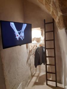 TV a/nebo společenská místnost v ubytování LA SEGRETA DEL CASTELLO, Private Access