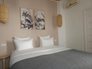Postel nebo postele na pokoji v ubytování Riad Coconut