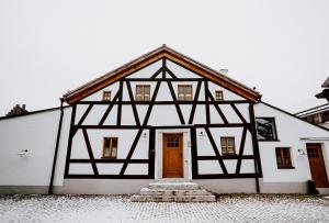 a black and white building with a door at Jura-Chalet in Riedenburg