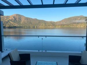 a view of a lake with mountains in the background at Casa Blanca SAMAO in Chichicasta