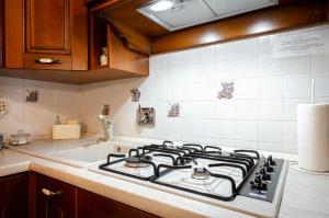 Kuchyň nebo kuchyňský kout v ubytování Casa Quarto di Luna
