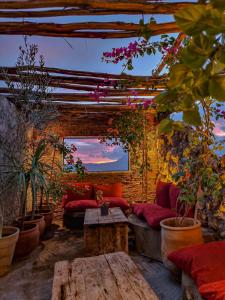 a living room with a couch and a table at Casa Amina in Chefchaouen