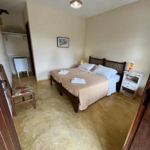 Una cama o camas en una habitación de Pousada Santuário - Caeté