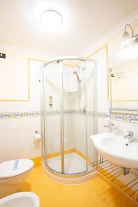 a bathroom with a shower and a toilet and a sink at Il Quartuccio Gaeta in Gaeta