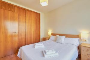 Posteľ alebo postele v izbe v ubytovaní Metropolitan Apartment