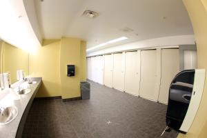 a bathroom with a row of sinks and toilets at Dalhousie University in Halifax