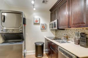 a kitchen with a sink and a refrigerator at Unique Studio in Dtwn NOLA, Walk to French Quarter in New Orleans