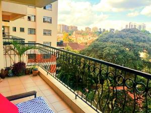 a balcony with a view of a city at Lavington Room1 in Nairobi