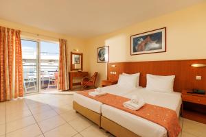 Posteľ alebo postele v izbe v ubytovaní Agrabella Hotel - Adults Only
