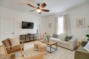 a living room with a couch and a ceiling fan at Cozy Virginia Home in Lynchburg Historic District! in Lynchburg