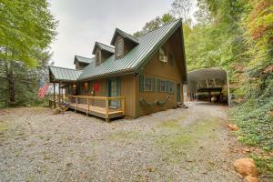 a house in the woods with a driveway at Robbinsville Vacation Rental with Covered Balcony in Robbinsville