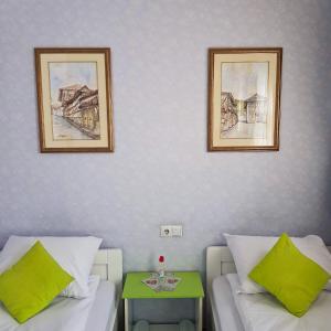 Letto o letti in una camera di Hotel Lula