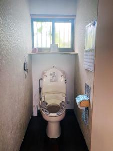 a bathroom with a toilet with the lid up at HolidayCottage”BANSHIRO” - Vacation STAY 10623v in Setouchi