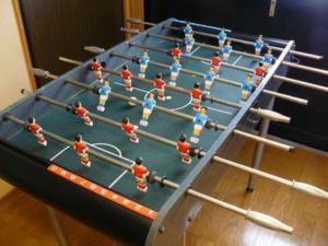 a group of people playing a game on a table at Ryokan Yamashiroya - Vacation STAY 21527v in Yufuin