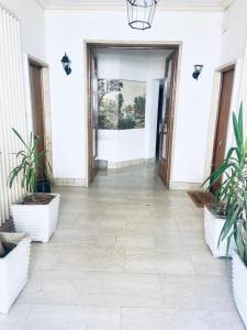 a hallway with potted plants in front of a building at Casa Futura in Rome