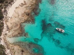 an aerial view of a boat in the ocean at South Bank in Long Bay Hills