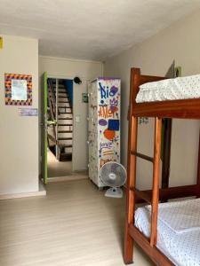 a dorm room with a bunk bed and a staircase at Hostel New Ipanema in Rio de Janeiro