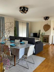 a living room with a table and a couch at Holiday Flat Green Coast in Espinho